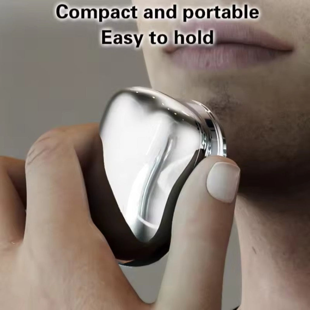 Compact portable electric shaver in use
